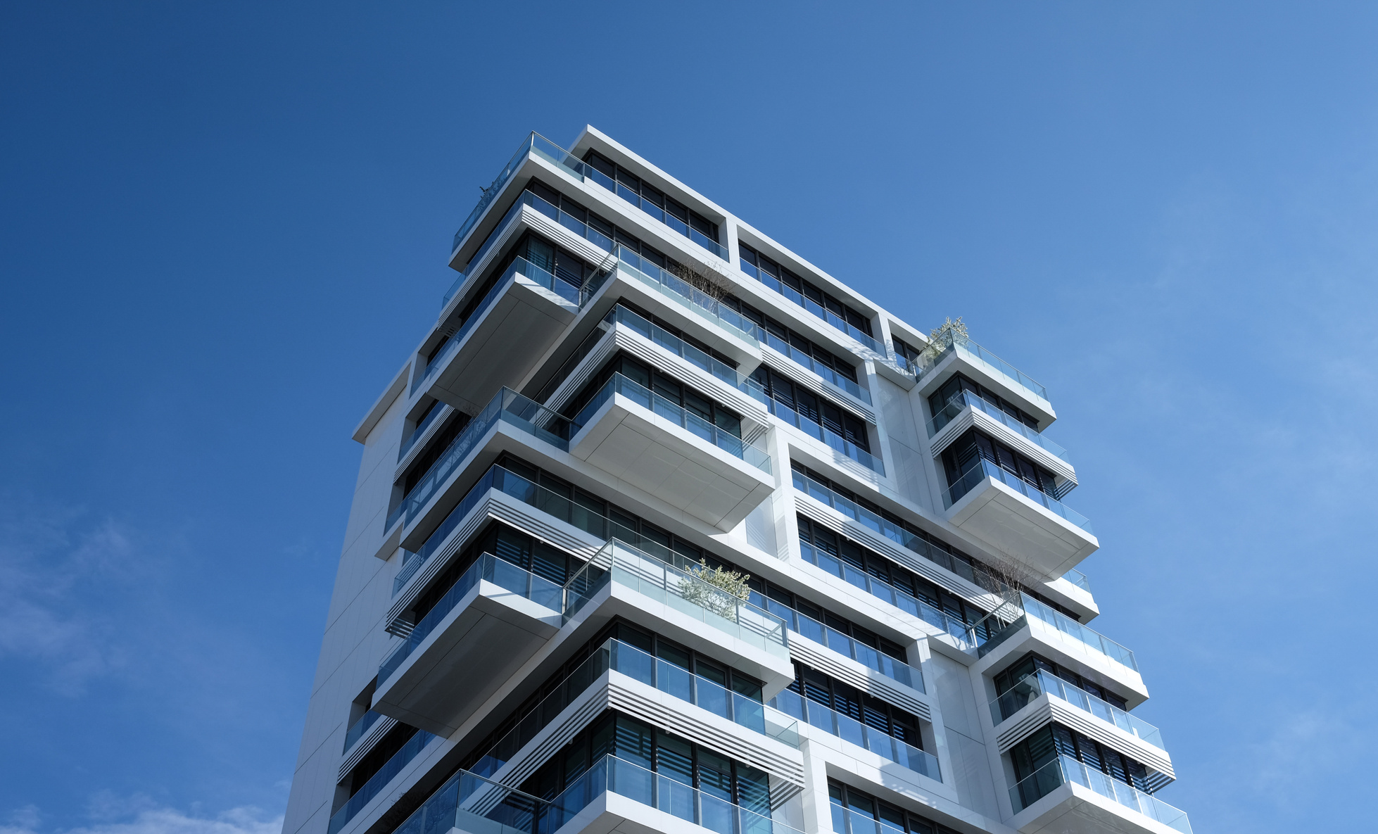 White Concrete Building Under Sunny Blue Sky